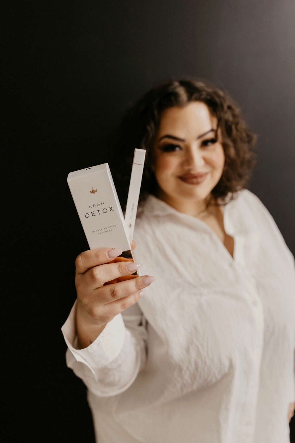 Char holding Lash Detox cleanser
